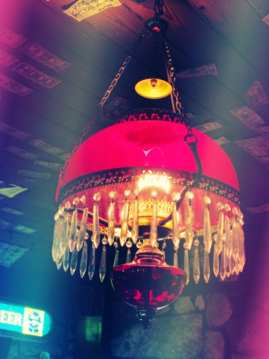 Red antique chandelier from Devil's Backbone Tavern in Fischer, TX
